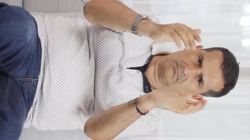 Vertical video of Man giving congratulatory message to camera applauding.