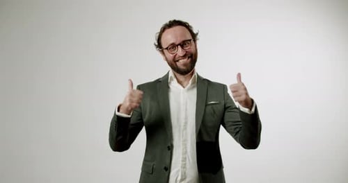 Man in Suit Giving Double Thumbs Up