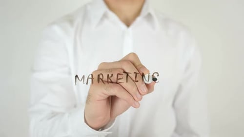 Writing Marketing on Clear Surface Close Up