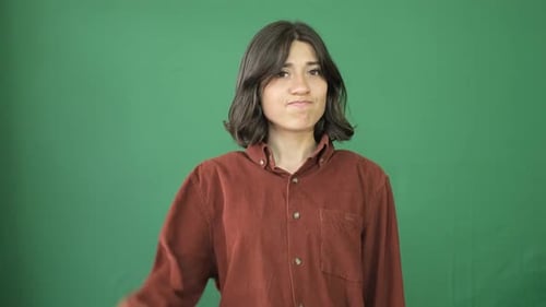 Woman Giving Thumbs Down on Green Screen