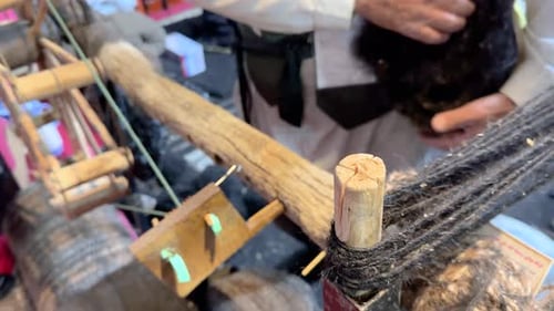 Traditional wooden spinning wheel tools spin Goat wool to make weaving fiber Handmade textile craft