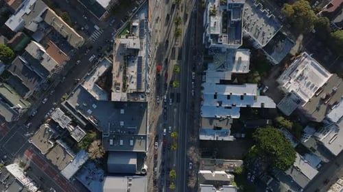 Birds Eye Shot of Traffic in Urban Borough Streets and Buildings in City From Height