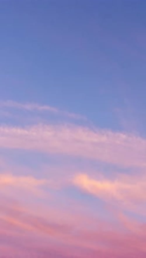 Time Lapse of Pink Clouds and Blue Sky at Sunset Vertical Video