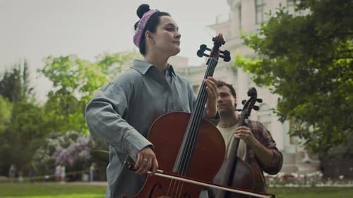 Young Talented Performers Playing Classical Music in Park