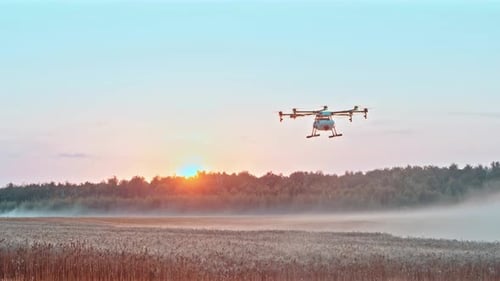 Drone Blowing Mist Over A Field