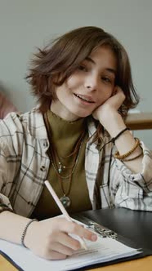 Vertical Portrait of Schoolgirl Writing Test at Health Education Lesson