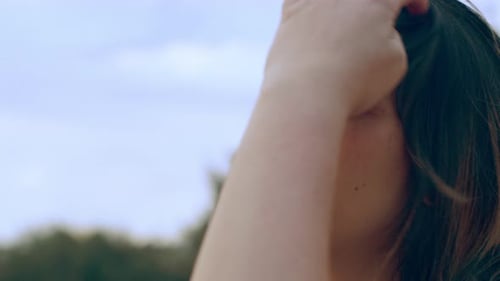 Young Woman Looking Out at the Water on a Beach in Australia