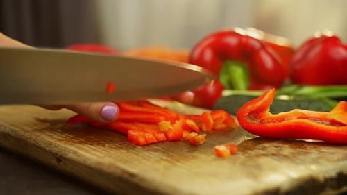 Close Up Chopping Red Pepper on Cutting Board