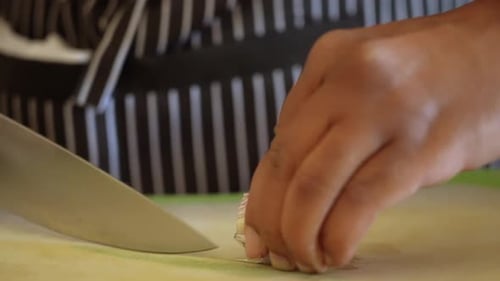Chopping shallots to add to the homemade salad dressing - ANTIPASTO SALAD DRESSING