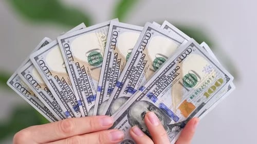 Excited Woman Showing Cash Money 1000 American Dollars Banknotes Hands with Money Close Up Income