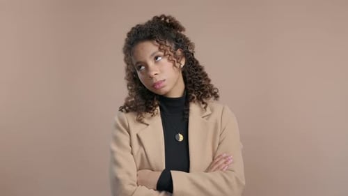 Young Woman Rolling Eyes with Arms Crossed