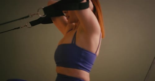 Woman Exercising on Pilates Machine in Studio