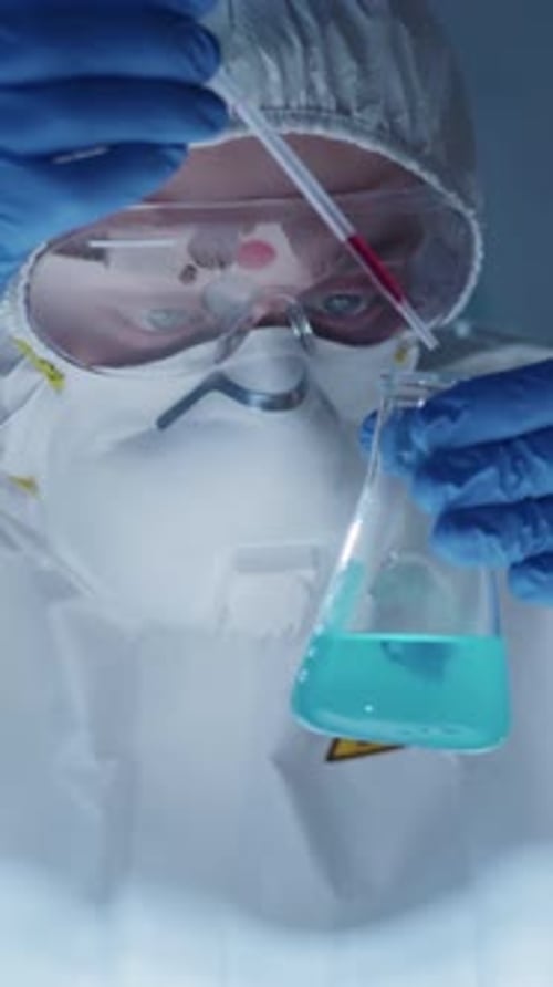 Medical Worker Working in Lab Mixing Chemicals
