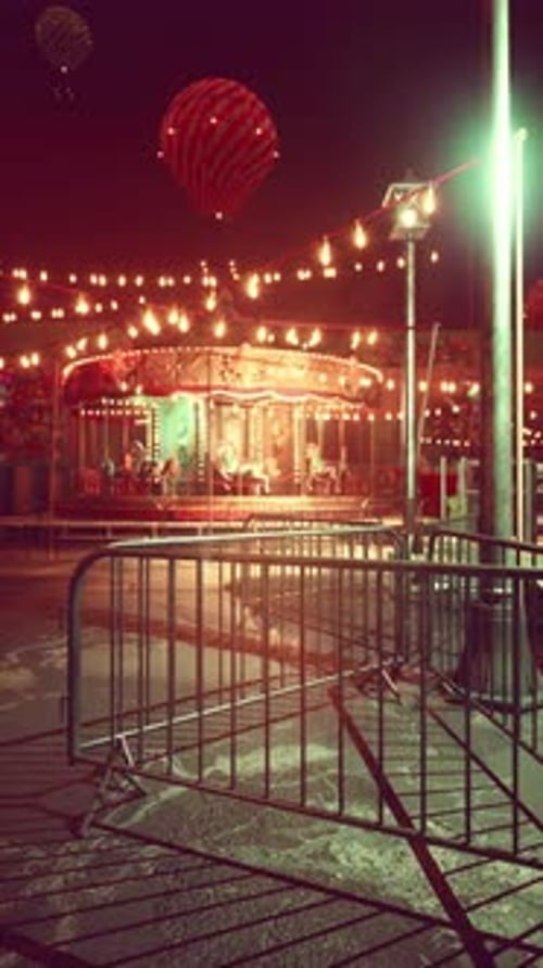 Illuminated Merry Go Round in Abandoned Amusement Park