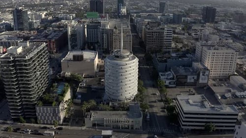 Aerial View of Capitol Records Building in Hollywood, Los Angeles USA on Sunny Evening, Orbiting Dro