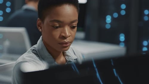 Woman Working in Futuristic Tech Office Environment