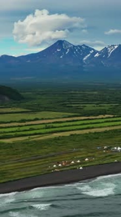Beach with Black Sand and Volcano
