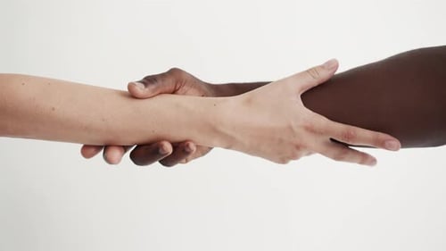 Giving Helping Mixed Hands Holding Together Close-Up. Adult Female and Male In