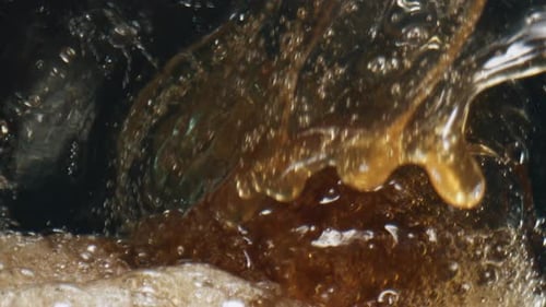 Bubbles and liquid swirling in a glass