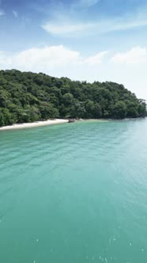Vertical Video Aerial View of Wooden Sailboats in a Turquoise Tropical Water Near the Shore