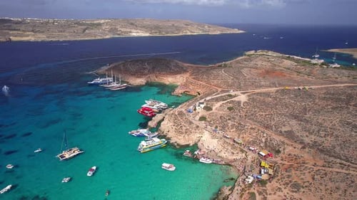 Aerial Over Beautiful Vibrant Blue Lagoon on Comino Island, Malta
