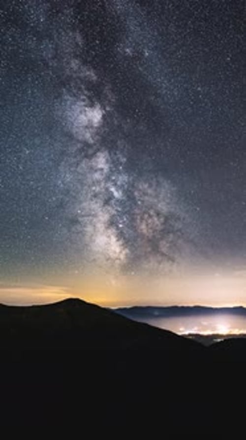 Vertical Video of Milky Way Galaxy Time lapse Night Stars Sky over Countryside