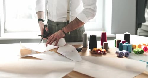 Tailoring Masterclass Cutting Fabric Patterns with Scissors and Thread Spools