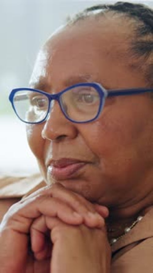 Memories, reflection and thinking with senior black woman in home for contemplation or recollection
