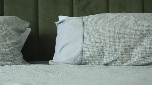 Close-up of Cozy Modern Bed with Soft Pillows
