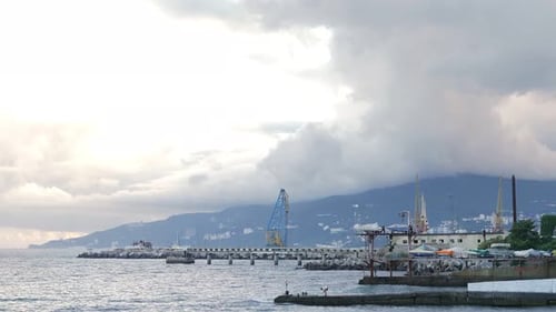View From the Top of the Seaside Beach to the Mountain Cliff and the Pier