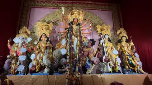 Religious Statue Display With Golden Decorations