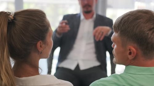 Attentive Couple in Counseling or Corporate Meeting