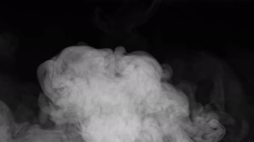 Billowing White Smoke Rising on a Black Background