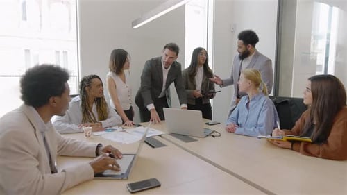Diverse Team Meeting in Modern Office Setting