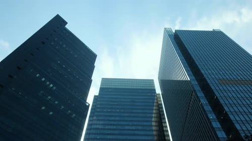 Time lapse of skyline commercial buildings and cloud sky.