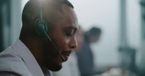 Close Up of African American Technical Support Specialist in Headset Helping Online on Phone Call