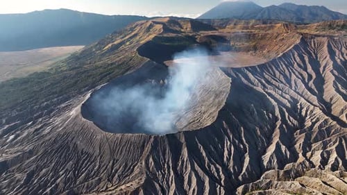 Spectacular aerial of Mount Bromo crater and smoke coming from active volcano. Indonesia