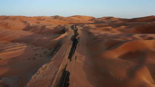 Asphalt road in sand dunes of Liwa desert, Abu-Dhabi, UAE