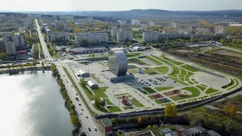 An Impressive Aerial View Showcasing the Vast Urban Development Situated Beside a Water Body Stock