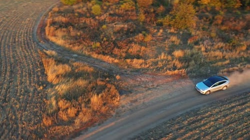 Aerial View of Electrical Car Speeding Through Dusty Route Ecology Friendly Auto on Electric Charge