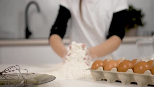Child Kneading Flour at Kitchen Counter with Eggs