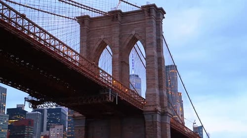 Close-up of the Brooklyn Bridge tower at dusk.