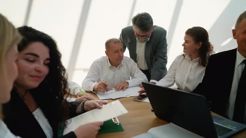Business Team Collaborating and Discussing a Project in an Office Meeting