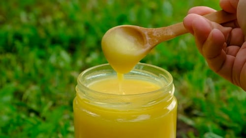 Ghee in a Jar in a Meadow Selective Focus