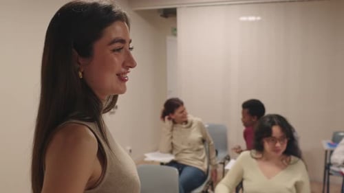 Woman Speaking in Classroom Setting with Other Adults