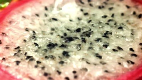 Water is Poured on a Cut Dragon Fruit Filmed on a Highspeed Camera at 1000 Fps