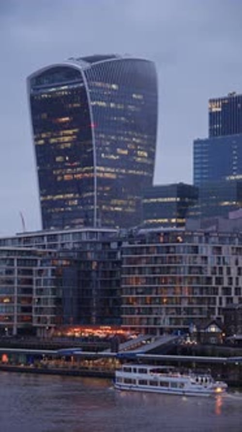 London, England - May 14, 2025: Cityscape view showing the Thames River, modern skyscrapers, includi