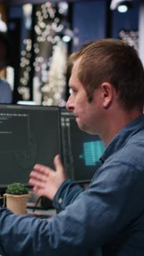 Vertical Video Software Developer in Office Receiving Critical Error Warning
