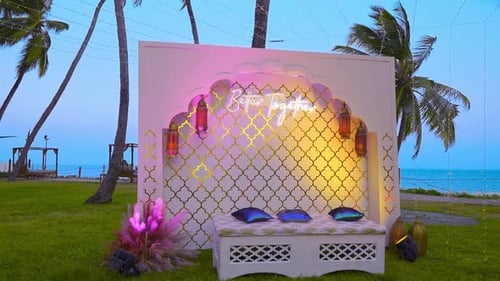 Zooming Into Distinctive Colorful Wedding Booth Placed Near Stunning Beach