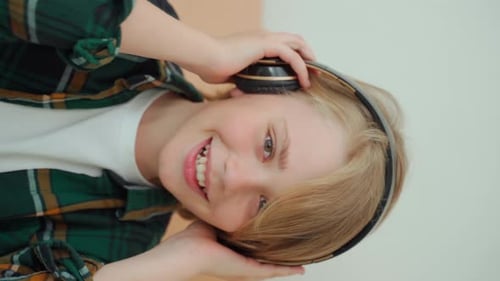Happy Child Listening to Music on Headphones